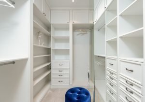white classic styled built-in wardrobe with empty shelves