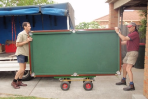 pool table being moved on dolly