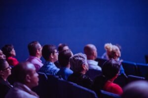 People seated on gang chairs