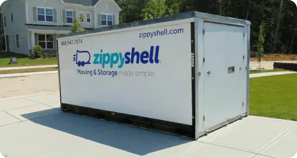Zippy Shell portable moving and storage container parked on a residential driveway