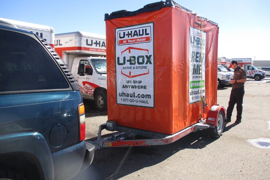U-Haul U-Box moving container loaded on a U-Haul trailer hitched to an SUV for self pickup